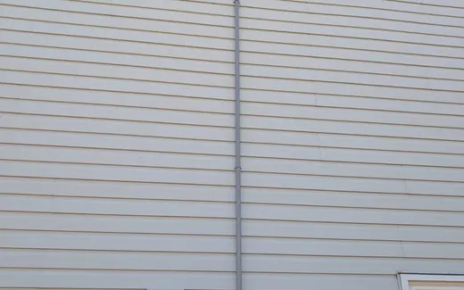 Exterior conduit run beside the home electrical meter