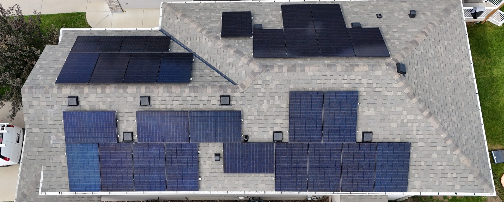 Aerial view of rooftop solar panels on a residential home